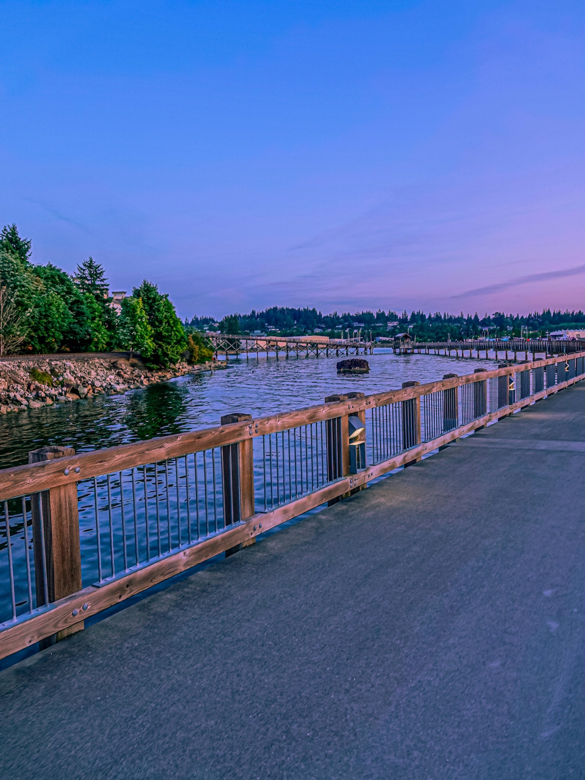 Waterfront boardwalk on Bellingham Bay at dusk along the South Bay Trail